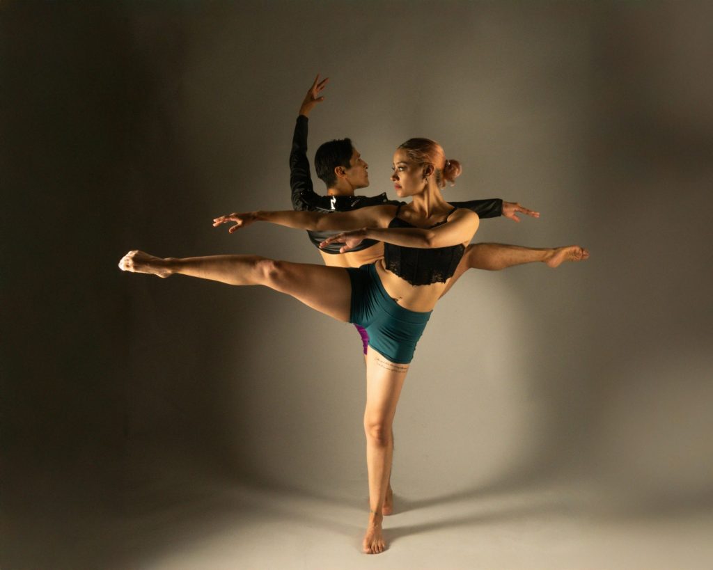 Elegant contemporary dance performance captured in a studio setting, showcasing grace and flexibility.
